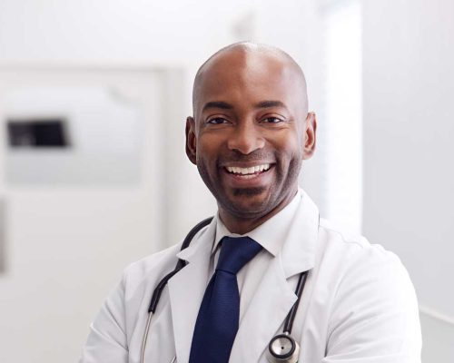 portrait-of-mature-male-doctor-wearing-white-coat-H49URGD-b.jpg